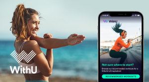Woman doing yoga on beach using WithU Fitness app.